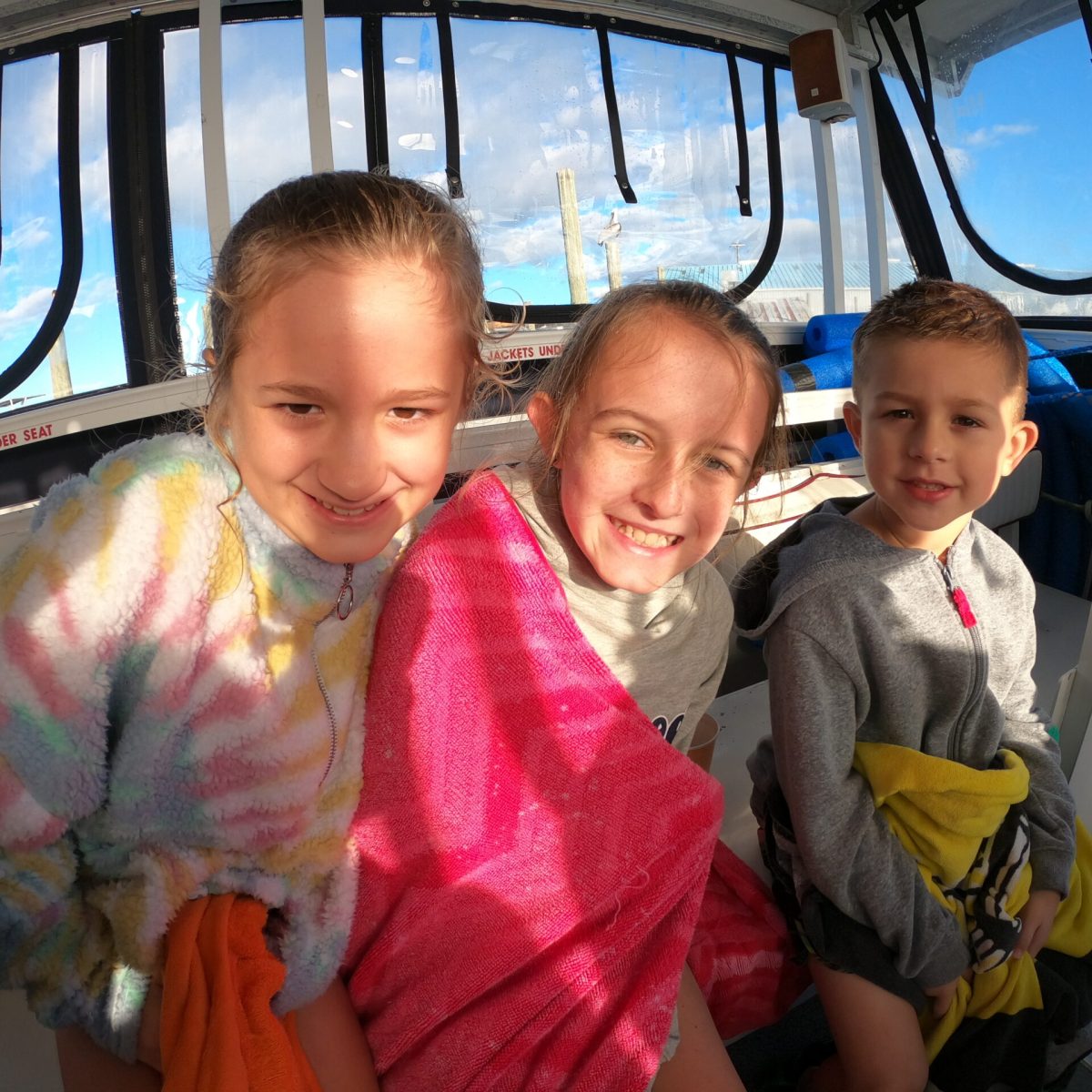 Happy kids on the way back to the dock after swimming with manatees.