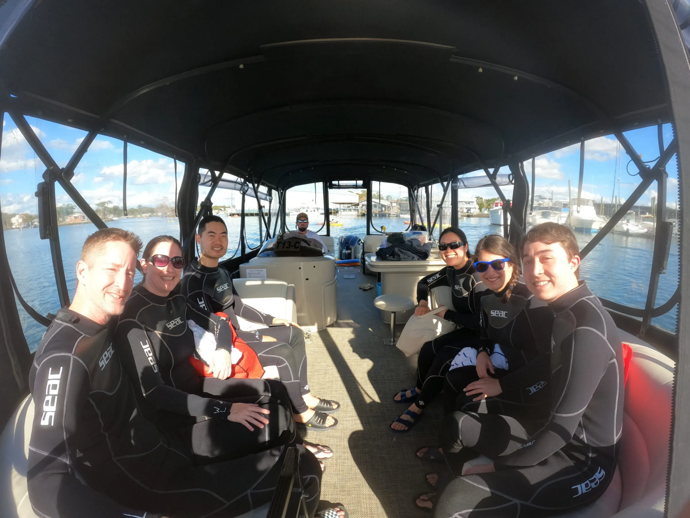 A family on a private tour to swim with manatees.