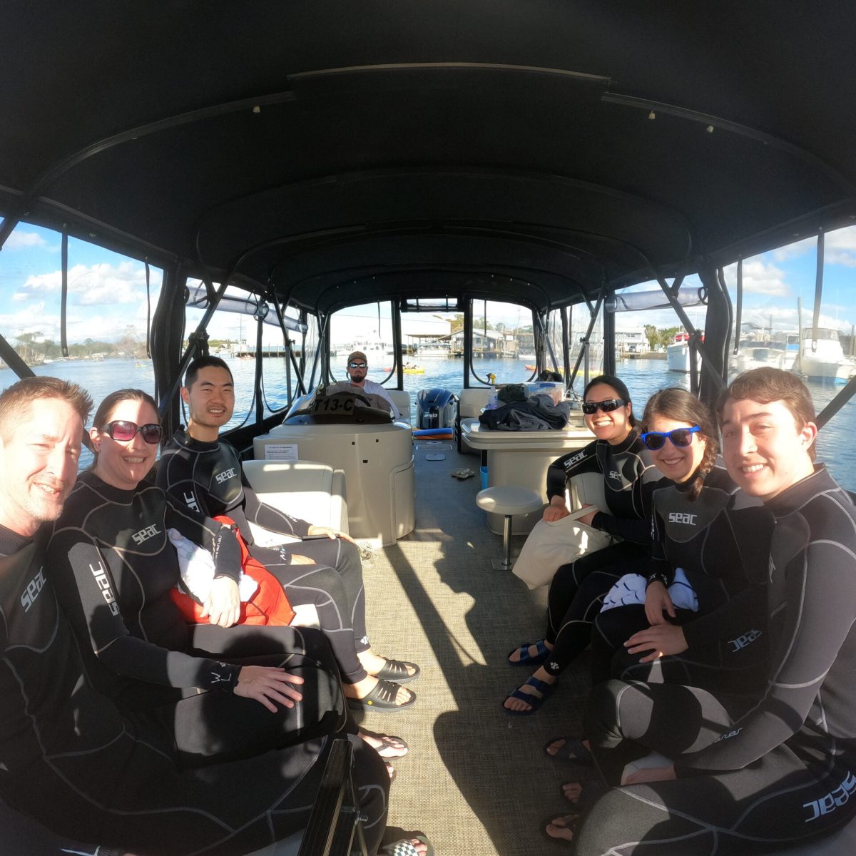 A family on a private tour to swim with manatees.
